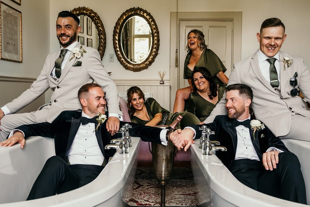 bridal party in the bathroom, grooms in the bath, gay wedding