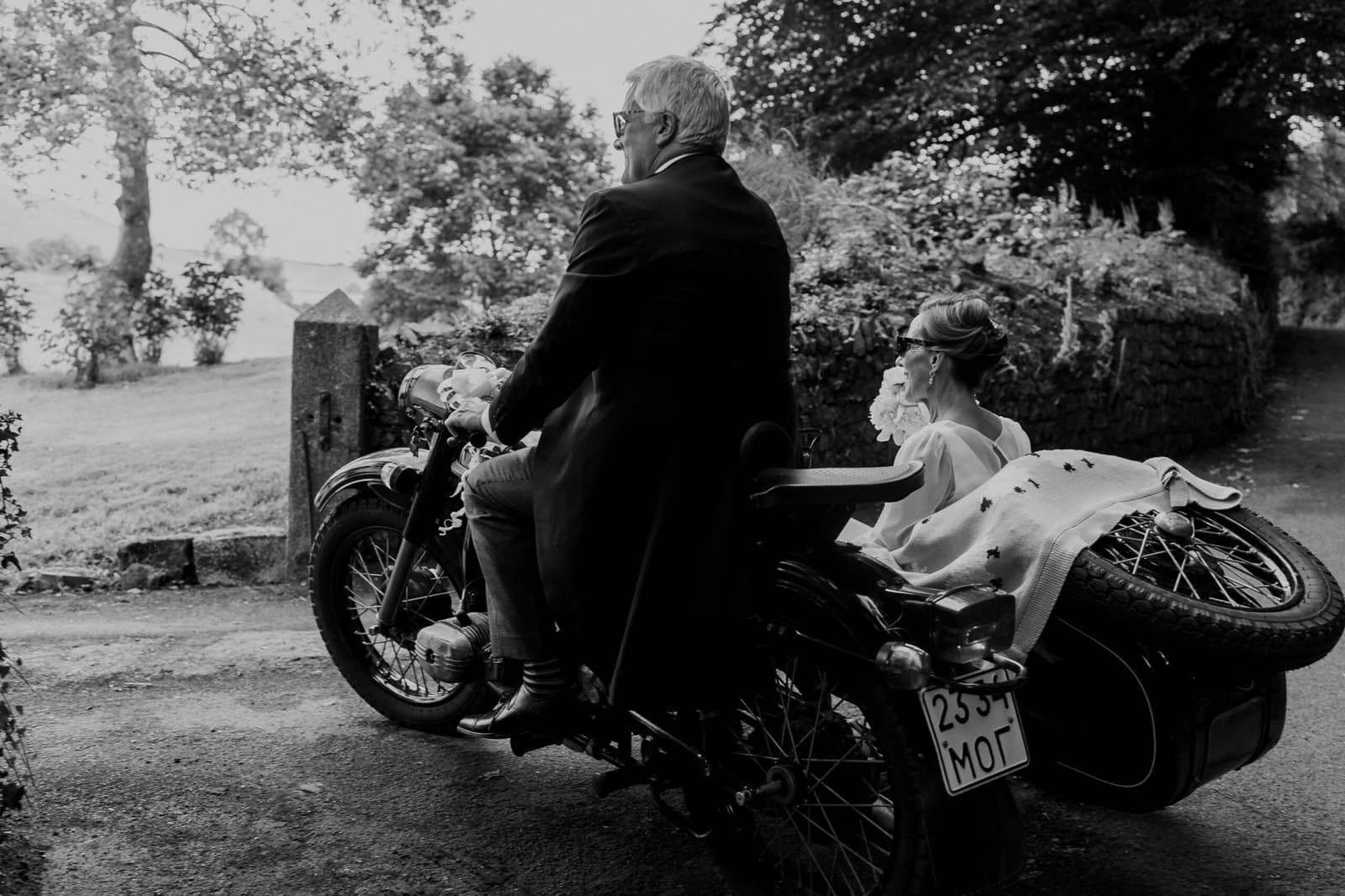 bride and groom on a vintage bike