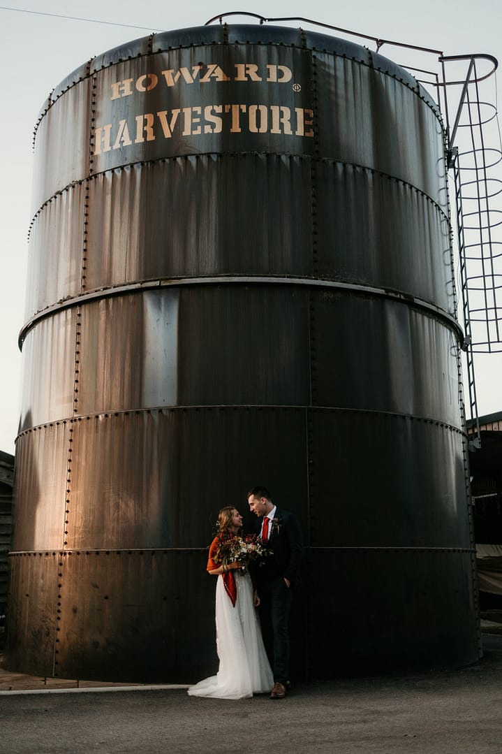 couple by grain silo
